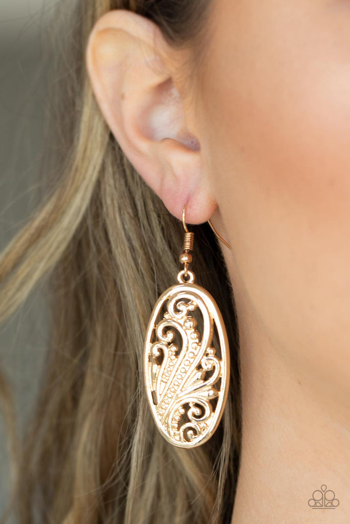 Featuring a high sheen gold finish, elegant frills and dotted designs blossom inside an oval frame create a swirling botanical allure. Earring attaches to a standard fishhook fitting.  Sold as one pair of earrings.