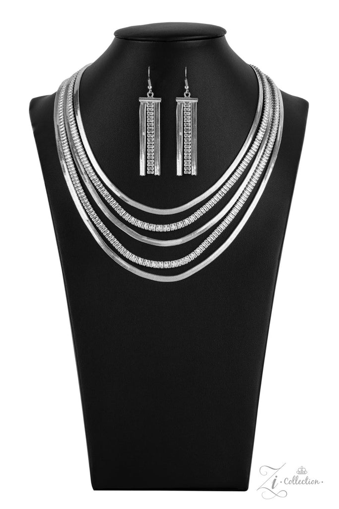 persuasive Alternating rows of flat silver snake chain and glassy strands of edgy emerald cut rhinestones sleekly layer below the collar. The deceptively simple metallic silver and white rhinestone palette is unapologetically mesmerizing, making this smooth statement piece an instant classic. Features an adjustable clasp closure.  Sold as one individual necklace. Includes one pair of matching earrings.