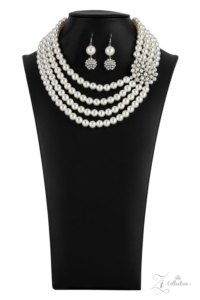 romantic Inspired by royalty, an elegant explosion of classic white rhinestones and timeless pearls delicately coalesces into a vintage brooch. The refined ornament delicately holds together strands of oversized pearls, creating romantically regal layers below the collar. Features an adjustable clasp closure.  Sold as one individual necklace. Includes one pair of matching earrings.