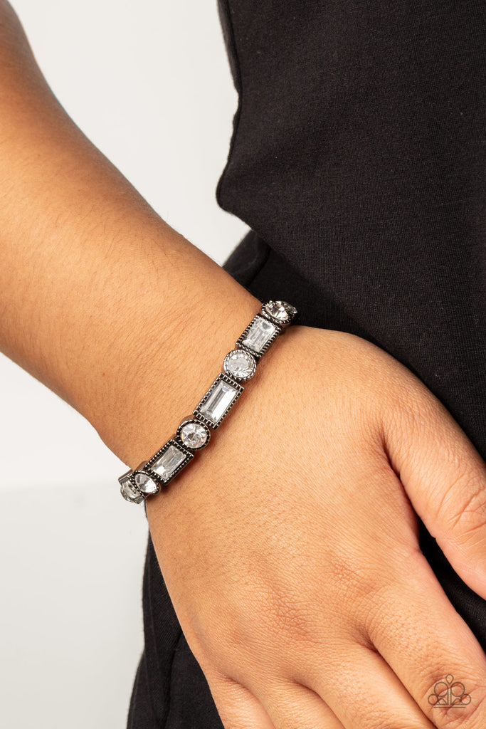 Classic round and baguette-cut rhinestones set in shiny dotted gunmetal frames alternate around the wrist on stretchy bands for a shimmering finish.  Sold as one bracelet.