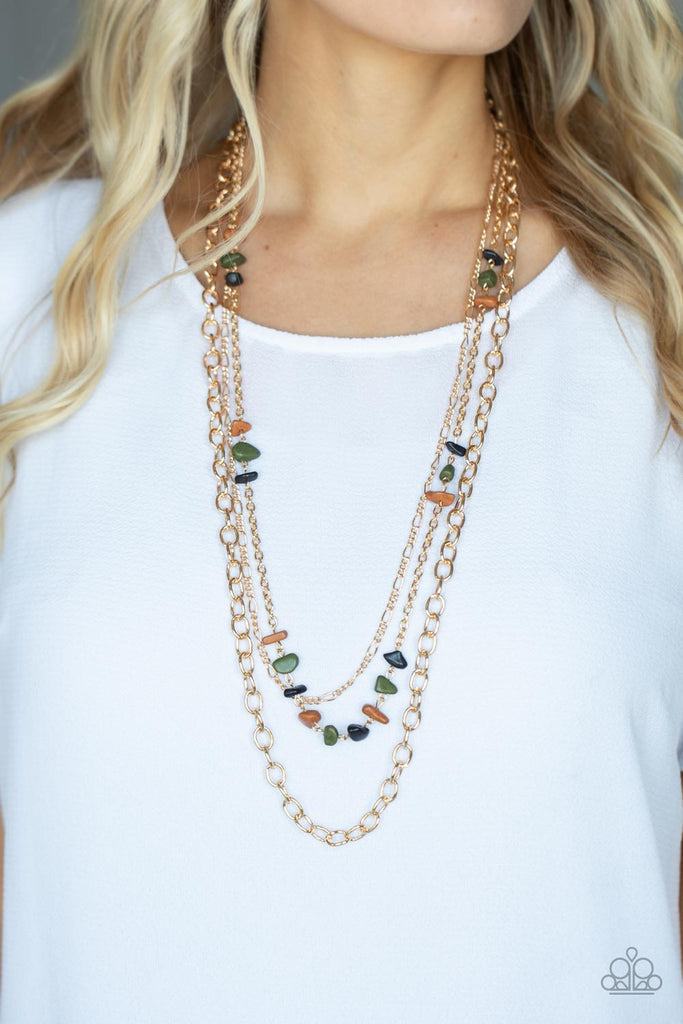 artisanal-abundance-multi Infused with sections of earthy brown, black, and green stones, a trio of mismatched gold chains layer down the chest for a dash of rustic refinement. Features an adjustable clasp closure.  Sold as one individual necklace. Includes one pair of matching earrings.