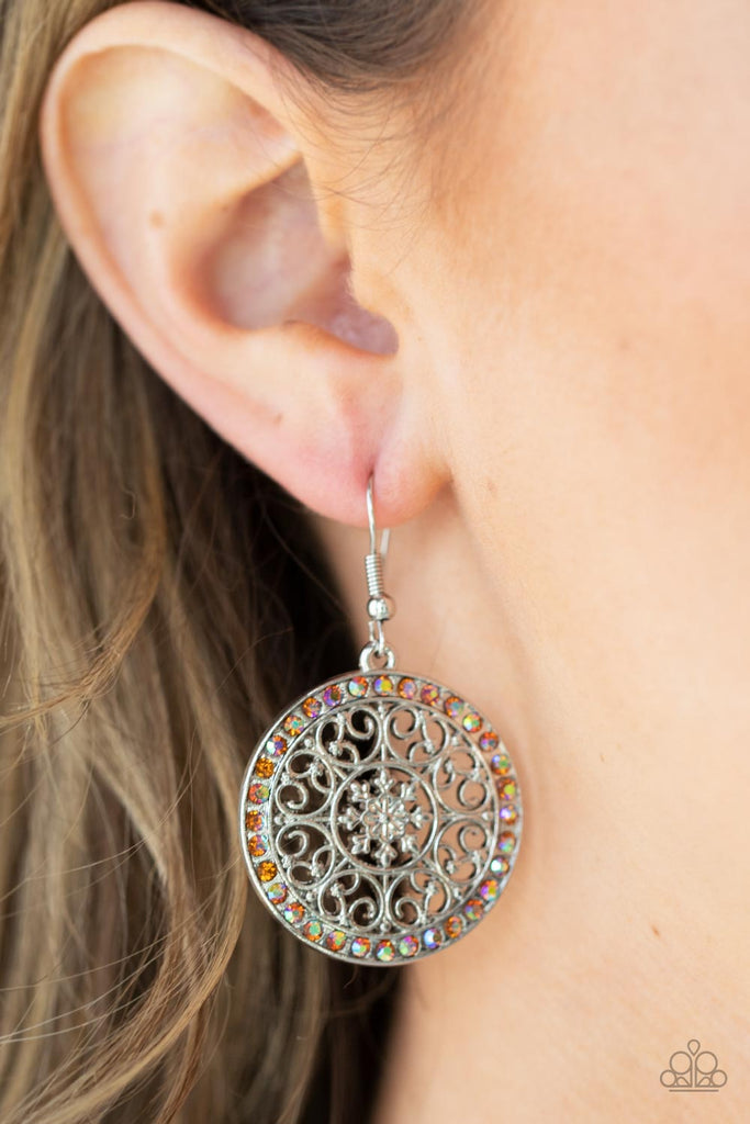 Infused with a border of iridescent orange rhinestones, studded silver heart shape filigree fans out from a decorative silver floral center for a whimsical look. Earring attaches to a standard fishhook fitting.  Sold as one pair of earrings.