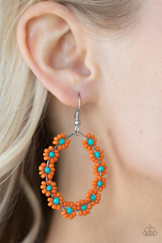 Dotted with turquoise beaded centers, a dainty collection of orange seed beaded floral frames are threaded along a wire hoop for a fabulous floral fashion. Earring attaches to a standard fishhook fitting.  Sold as one pair of earrings.