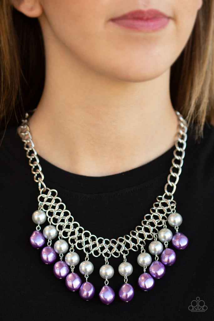A collection of classic and imperfect silver and purple pearls dangle from a web of interlocking silver links below the collar, adding a modern twist to the timeless palette. Features an adjustable clasp closure.  Sold as one individual necklace. Includes one pair of matching earrings.