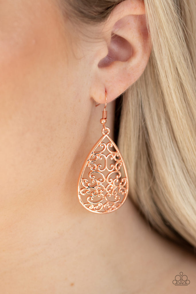 Vine-like filigree climbs the center of a shiny copper teardrop, creating a whimsical frame. Earring attaches to a standard fishhook fitting.  Sold as one pair of earrings.