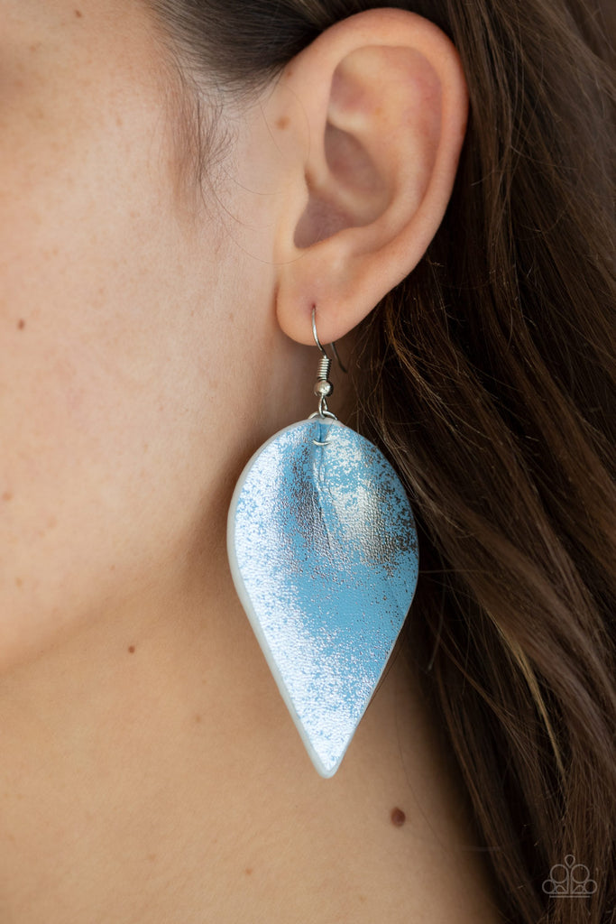 Dusted in a silvery shimmer, a leathery Faded Denim leaf swings from the ear for an enchanted look. Earring attaches to a standard fishhook fitting.  Sold as one pair of earrings.