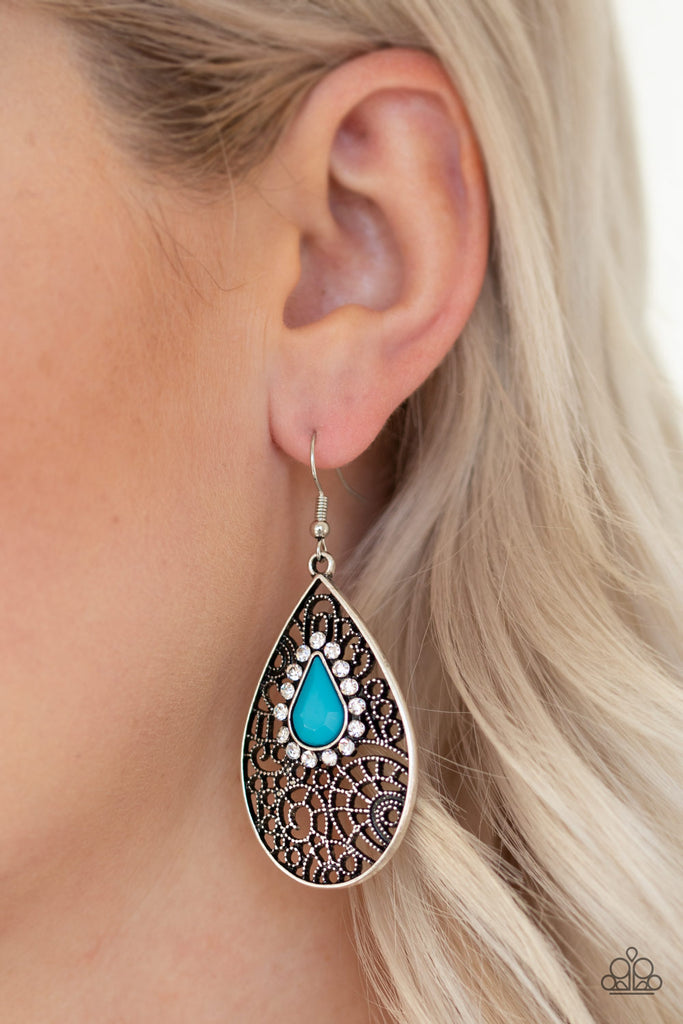 Ringed in glassy white rhinestones, a teardrop blue bead is pressed into a shimmery silver frame radiating with airy filigree for a refined fashion. Earring attaches to a standard fishhook fitting.  Sold as one pair of earrings.