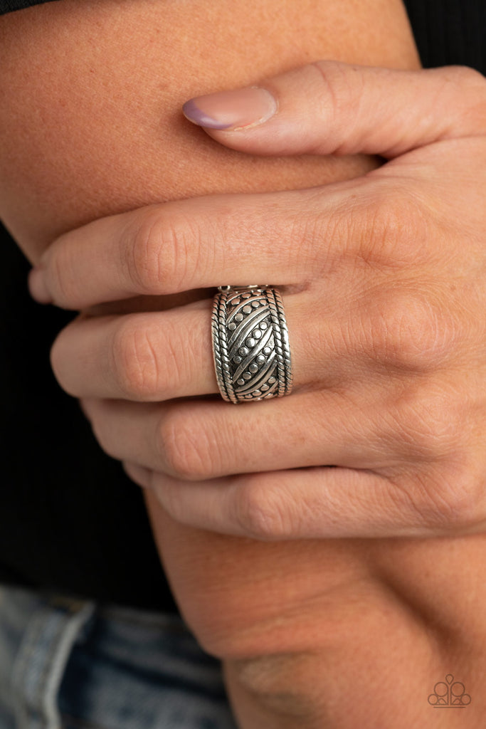 Studded and smooth silver bars delicately slant across the finger between two borders of silver rope-like texture, coalescing into an edgy band. Features a stretchy band for a flexible fit.  Sold as one individual ring.