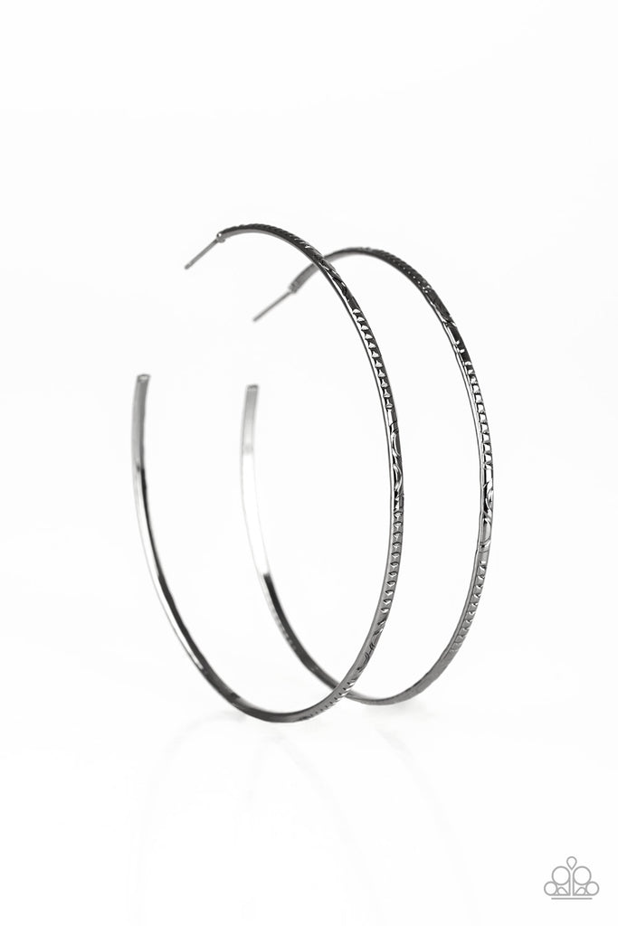 Etched in mismatched textures, a dainty gunmetal bar curls into a patterned hoop for a seasonal look. Earring attaches to a standard post fitting. Hoop measures 2 3/4" in diameter.  Sold as one pair of hoop earrings.
