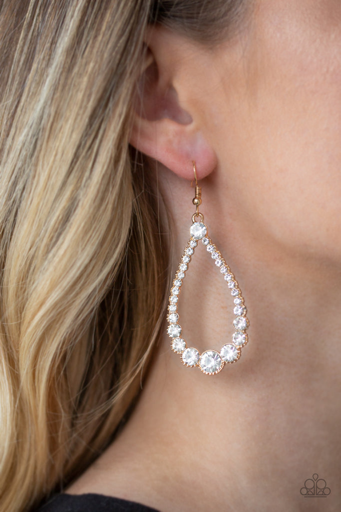 A collection of glassy white rhinestones are encrusted along the front of an ornate gold teardrop. The sparkling rhinestones gradually increase in size at the bottom of the lure for a sophisticated finish. Earring attaches to a standard fishhook fitting.  Sold as one pair of earrings.