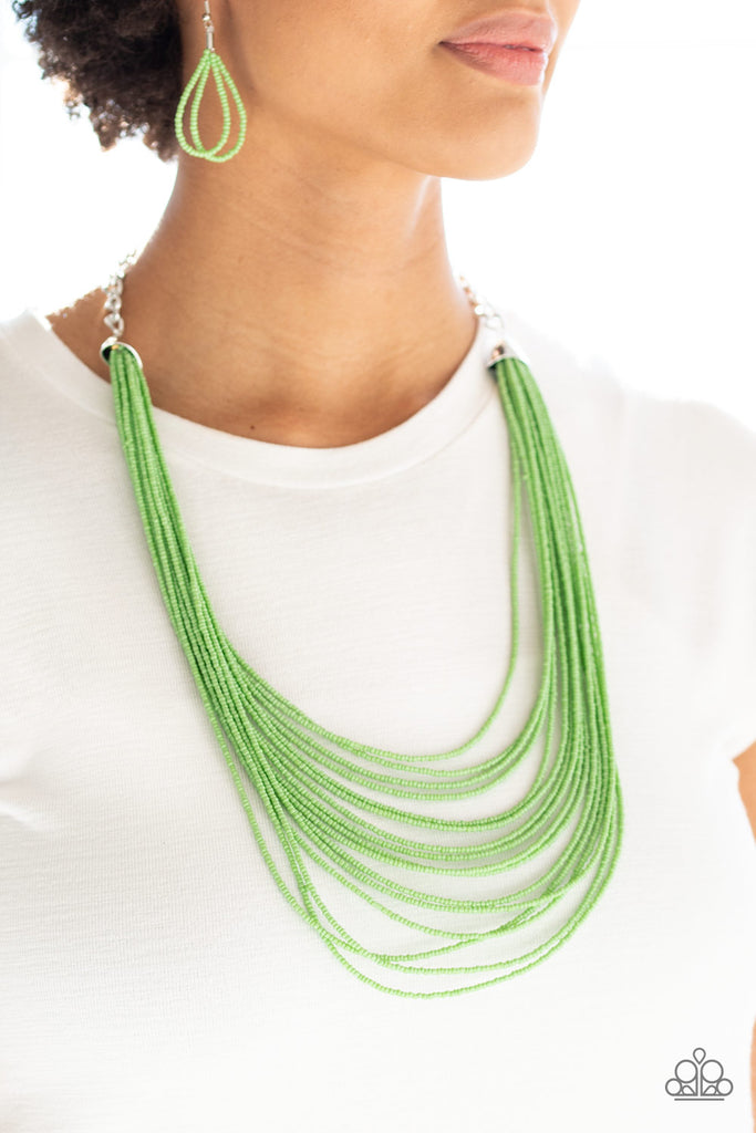 Infused with two bold silver fittings, row after row of green seed beads layer across the chest for a seasonal fashion. Features an adjustable clasp closure.  Sold as one individual necklace. Includes one pair of matching earrings.