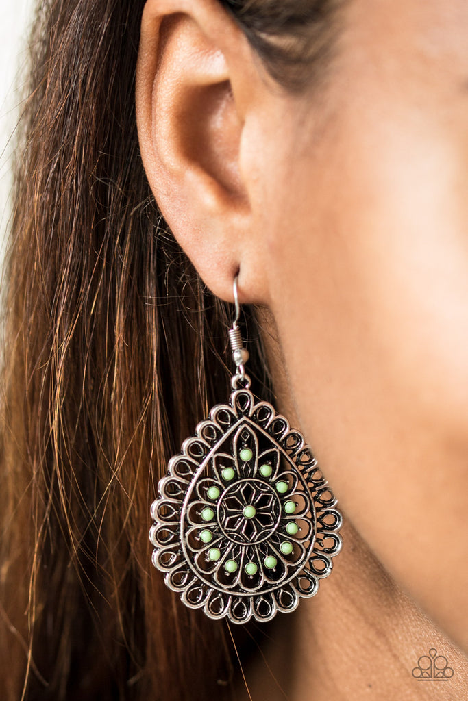 Dainty green beads are pressed into a frilly silver teardrop for a whimsical look. Earring attaches to a standard fishhook fitting.  Sold as one pair of earrings.