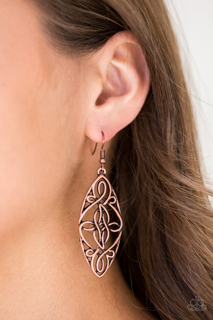 Brushed in an antiqued shimmer, glistening copper wire twists into a decorative frame for a seasonal look. Earring attaches to a standard fishhook fitting.  Sold as one pair of earrings.