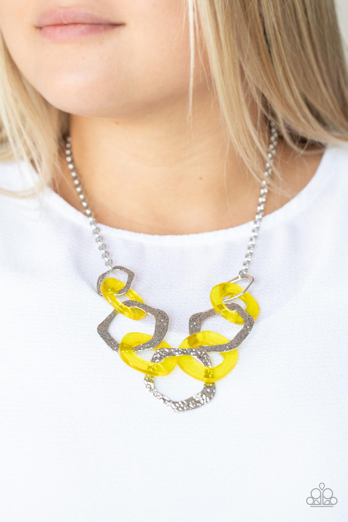 An asymmetrical assortment of Illuminating acrylic rings and hammered silver hoops boldly interlock below the collar, creating an intense pop of color. Features an adjustable clasp closure.  Sold as one individual necklace. Includes one pair of matching earrings.  