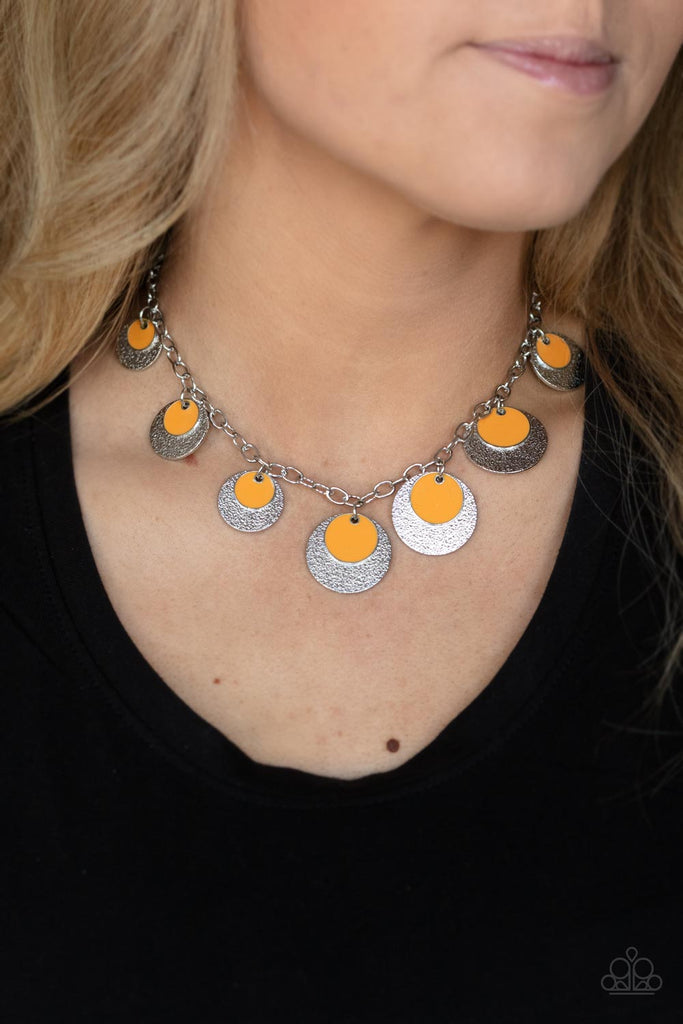 A stunning array of sparkling textured silver discs layered with orange accent discs, fans out across the collar for a show-stopping cosmic display. Features an adjustable clasp closure.  Sold as one individual necklace. Includes one pair of matching earrings.