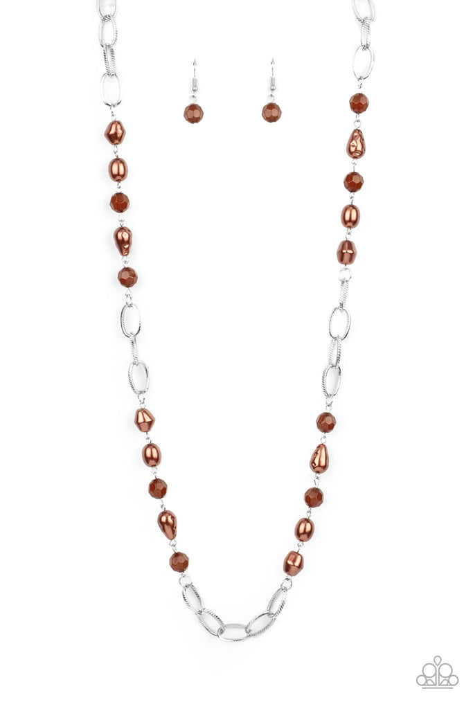 tea-party-tango-brown Featuring imperfectly faceted and hammered finishes, pearly brown teardrop and round beads join opaque brown crystal-like accents along sections of chunky silver chain across the chest for a glamorous look. Features an adjustable clasp closure.  Sold as one individual necklace. Includes one pair of matching earrings.