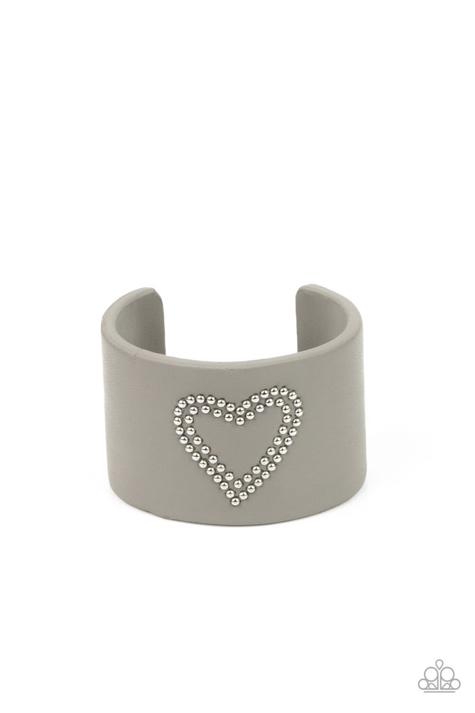 rodeo-romance-silver The center of an Ultimate Gray leather cuff is studded in a charming heart pattern, creating a rustically romantic look around the wrist.  Sold as one individual bracelet.