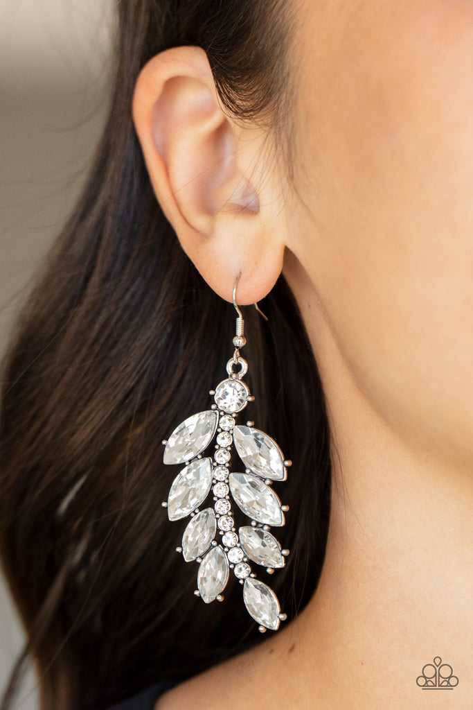 Oversized marquise cut white rhinestones fan out from a curved silver bar encrusted in glassy white rhinestones, resulting into a glamorously leafy statement piece. Earring attaches to a standard fishhook fitting.  Sold as one pair of earrings.