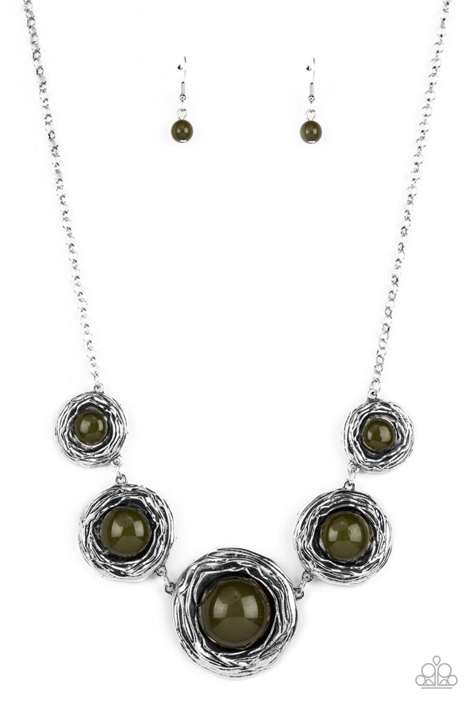 the-next-nest-thing-green  Gradually increasing in size, a bubbly collection of oversized Olive Branch beads adorn the centers of folds of silver buds below the collar for a seasonal fashion. Features an adjustable clasp closure.  Sold as one individual necklace. Includes one pair of matching earrings.