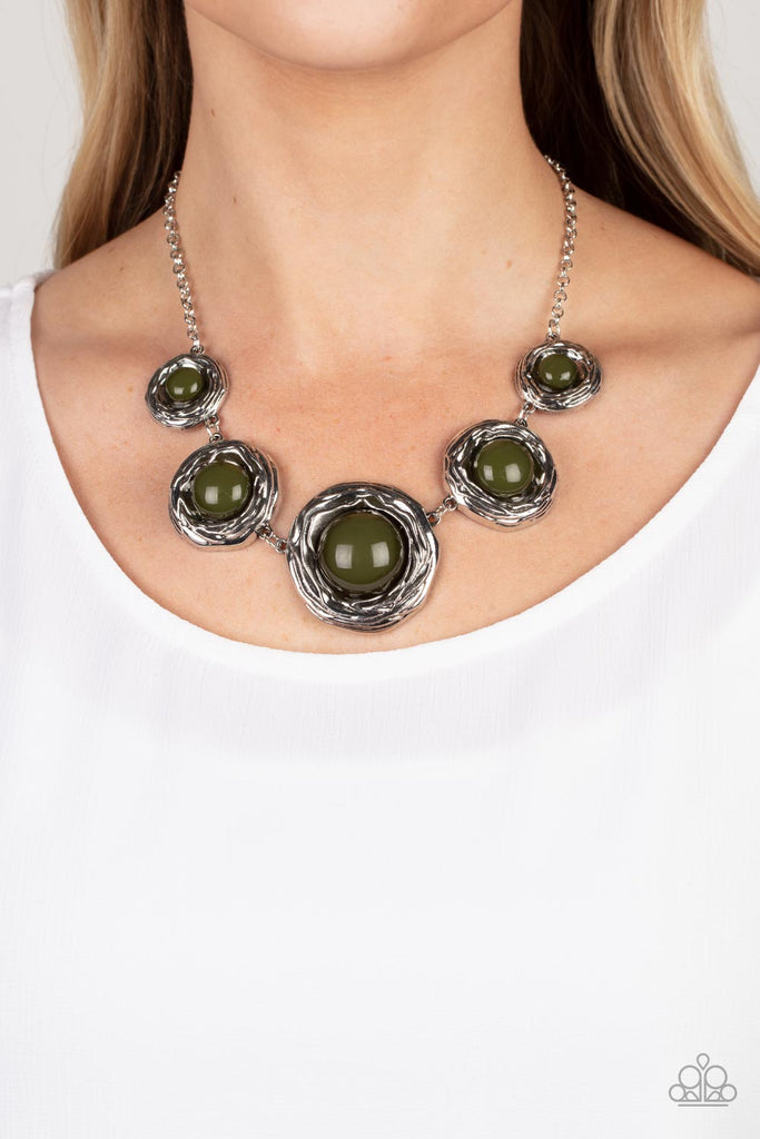 the-next-nest-thing-green  Gradually increasing in size, a bubbly collection of oversized Olive Branch beads adorn the centers of folds of silver buds below the collar for a seasonal fashion. Features an adjustable clasp closure.  Sold as one individual necklace. Includes one pair of matching earrings.