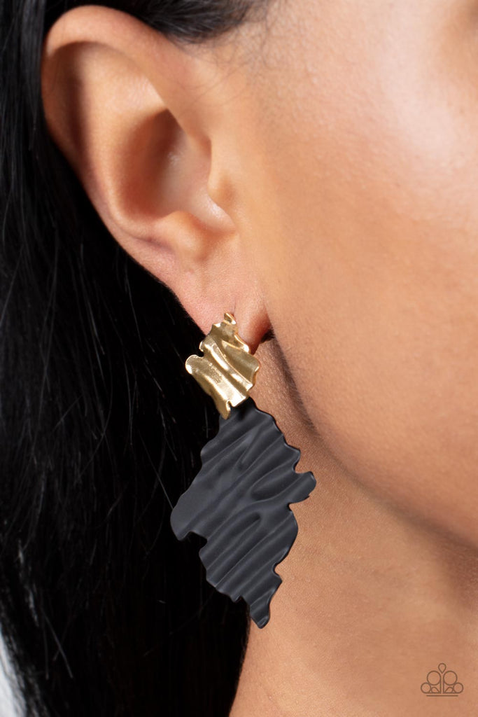 Painted in a matte finish, a rippling black frame links to a dainty gold frame featuring crimped texture, resulting in a modern lure. Earring attaches to a standard post fitting.  Sold as one pair of post earrings.