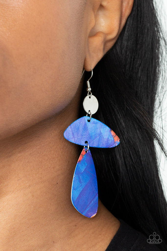 Painted in abstract blue details, a pair of asymmetrical frames swing form the bottom of a dainty silver disc for an artsy look. Earring attaches to a standard fishhook fitting.  Sold as one pair of earrings.  