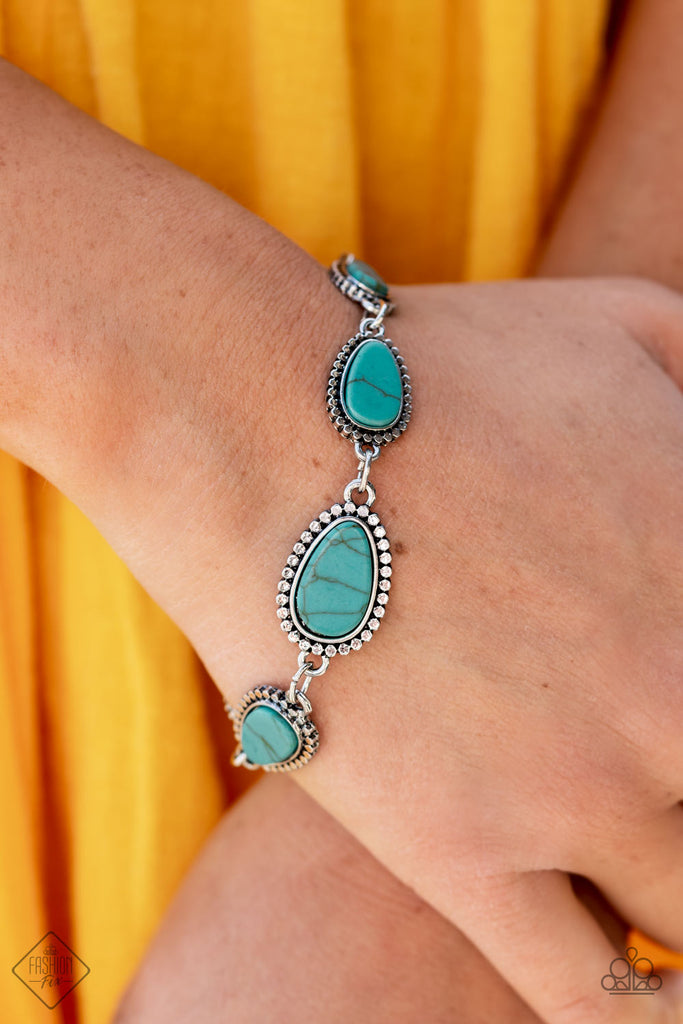 Encased in frames of flattened silver studs, pieces of flat turquoise stone teardrops gradually increase in size as they link around the wrist for an artisan-inspired look. Features an adjustable clasp closure.  Sold as one individual bracelet.