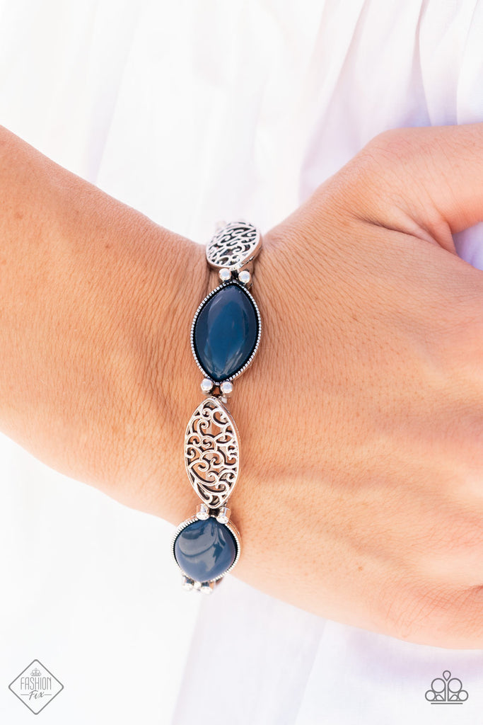 Dewy Navy Blue opals set in daintily studded silver frames mingle with frames of swirling silver filigree as they alternate along stretchy bands for a whimsically wild fashion around the wrist.  Sold as one individual bracelet.