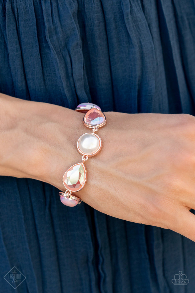 A collection of classic white pearls, Pale Rosette pearls glazed in a reflective finish, and iridescent teardrops wrap around the wrist in an ethereal display. Rose gold frames encase each bead, adding a romantic vibe to the vintage inspired design. Features an adjustable clasp closure.  Sold as one individual bracelet.