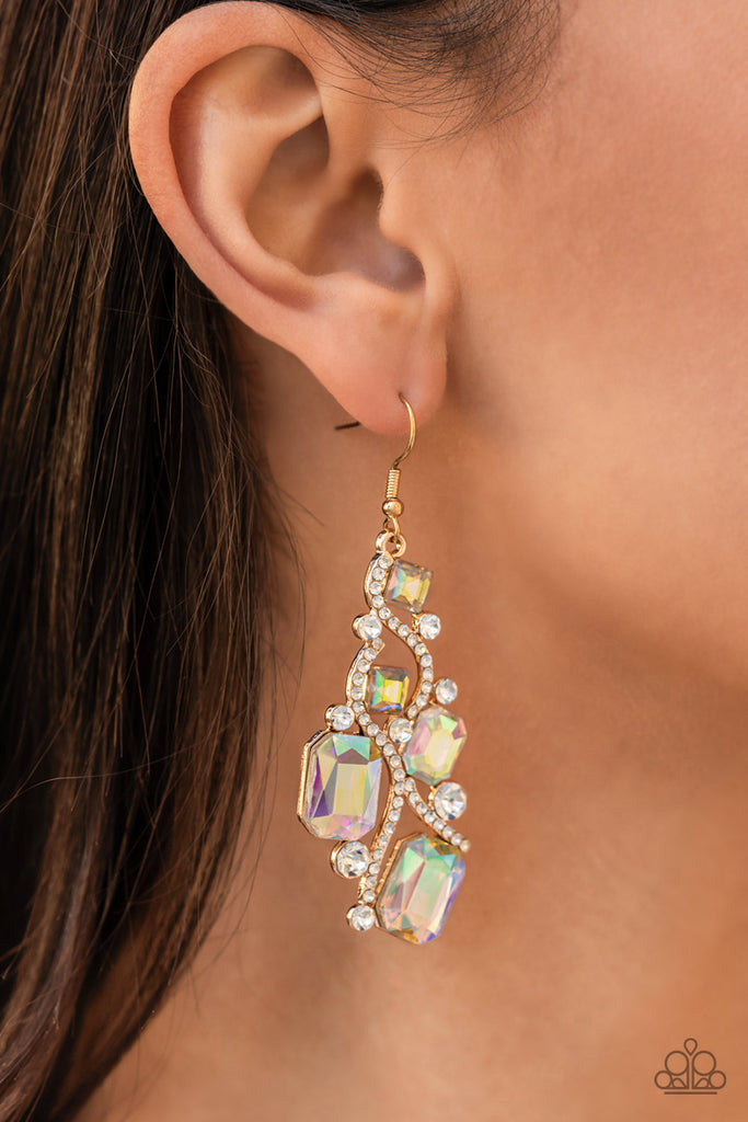 Golden ribbons of glassy white rhinestones whirl around a chandelier of classic round white rhinestones and emerald and square cut iridescent rhinestones, coalescing into an effervescent elegance. Earring attaches to a standard fishhook fitting.