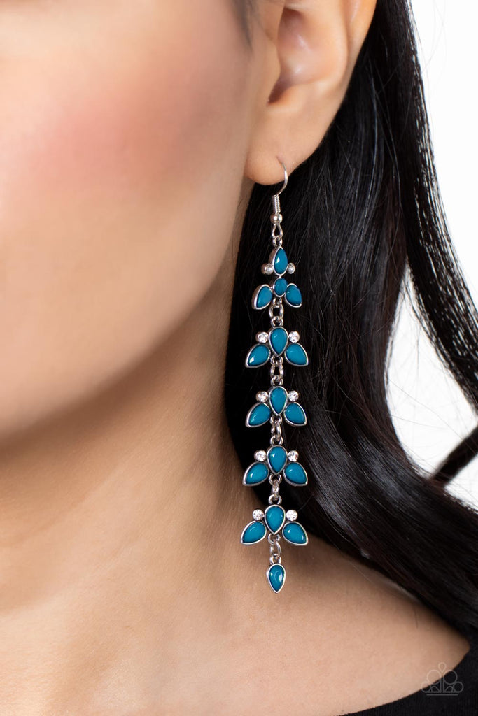 Infused with pairs of dainty white rhinestones, faceted Mykonos Blue teardrop beads delicately connect into leafy frames that link into an extended lure for an elegant finish. Earring attaches to a standard fishhook fitting.  Sold as one pair of earrings.