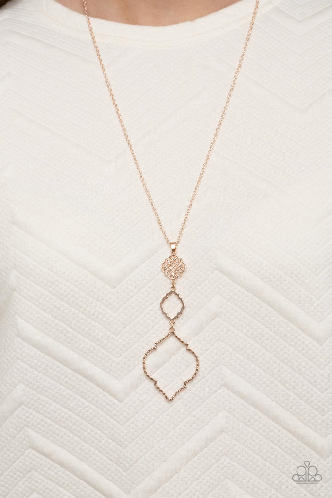 Featuring mandala-like patterns, a floral lattice frame gives way to mismatched scalloped rose gold frames, creating a magnificently stacked pendant at the bottom of an extended rose gold chain. Features an adjustable clasp closure.  Sold as one individual necklace. Includes one pair of matching earrings.