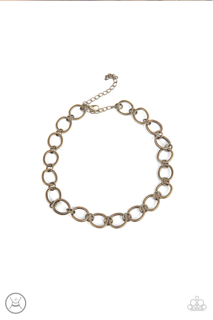 90s-nostalgia-brass  Brushed in an antiqued finish, imperfectly shaped circles link together for a gritty industrial statement. Features an adjustable clasp closure.  Sold as one individual choker necklace. Includes one pair of matching earrings.