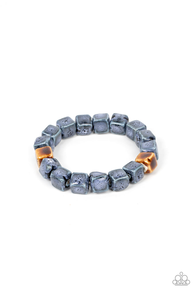 Featuring distressed blue and brown glazed finishes, a rustic collection of ceramic cube beads are threaded along stretchy bands around the wrist for a colorful flair.  Sold as one individual bracelet.