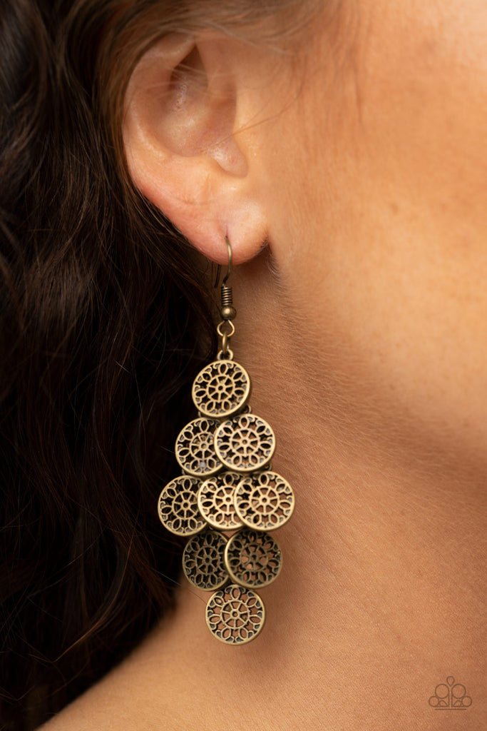 Featuring floral detail, stenciled brass frames cascade from a brass netted backdrop as they delicately overlap into a whimsical lure. Earring attaches to a standard fishhook fitting.  Sold as one pair of earrings.