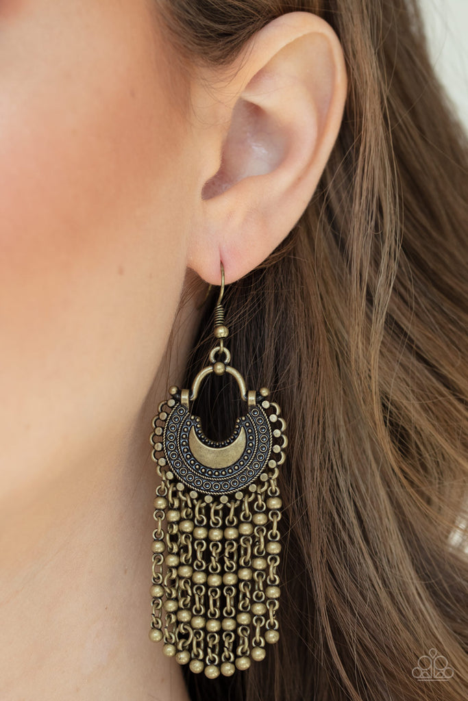 Beaded brass chains stream from the bottom of a textured half-moon brass frame, creating a dreamy fringe.    Earring attaches to a standard post fitting.  Sold as one pair of earrings.