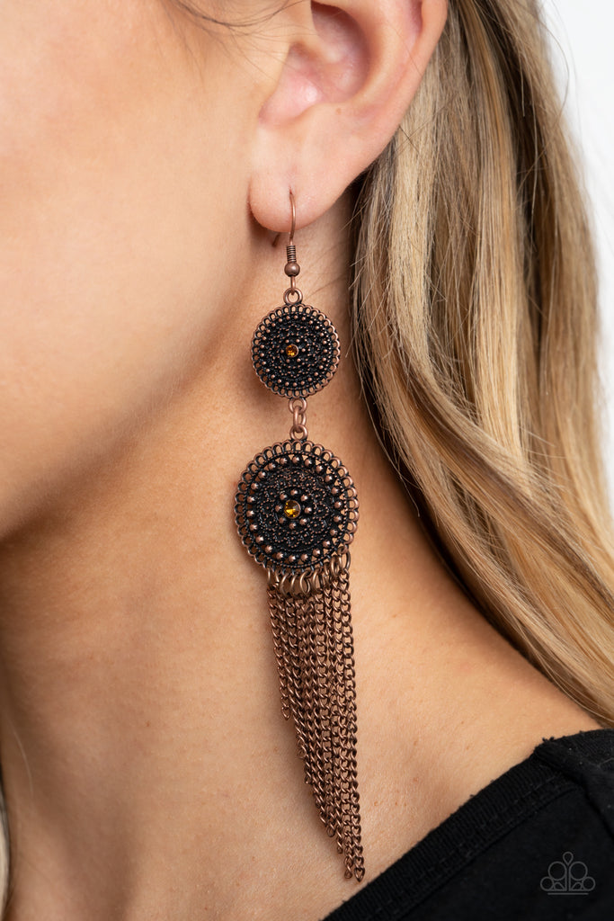 Dotted with topaz rhinestone centers, two studded copper floral frames give way to an antiqued copper chain fringe for a whimsically stacked look. Earring attaches to a standard fishhook fitting.  Sold as one pair of earrings.