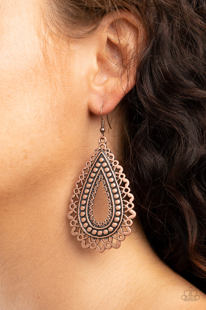 Petal-like textures fan out from a studded copper teardrop frame, creating a shiny metallic floral pattern. Earring attaches to a standard fishhook fitting.  Sold as one pair of earrings.