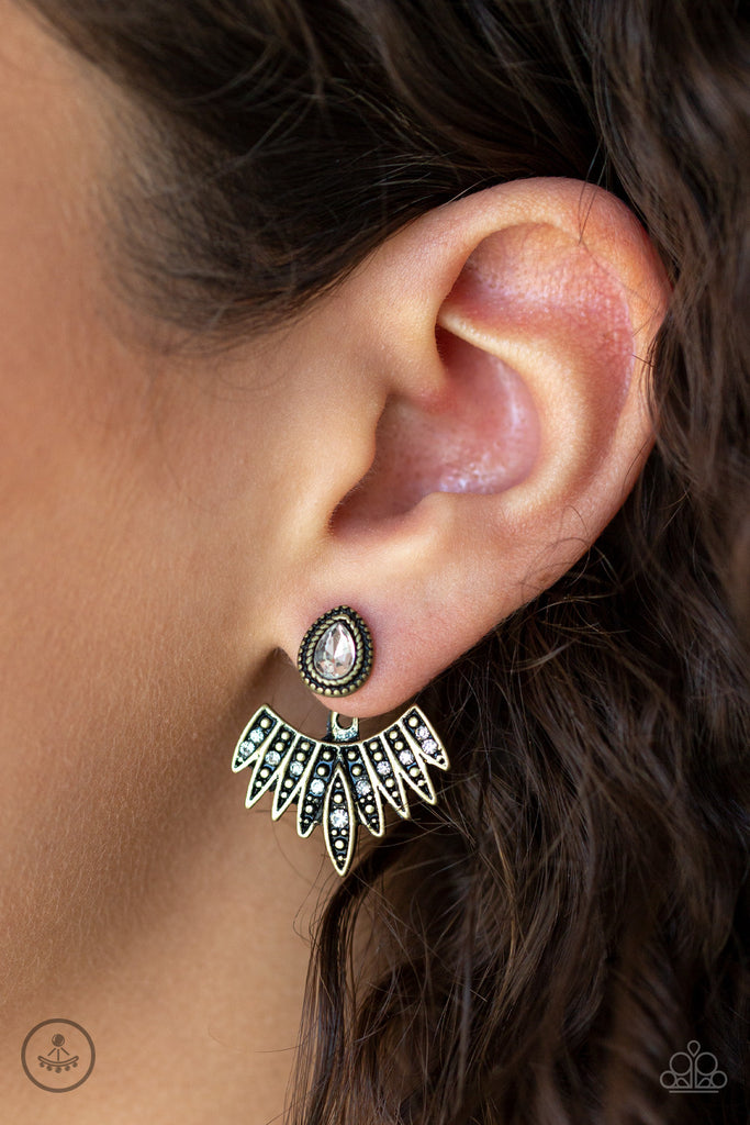A solitaire white teardrop rhinestone attaches to a double-sided post, designed to fasten behind the ear. Dusted in glassy white rhinestones, the wing-like double-sided post fans out beneath the ear for a bold look. Earring attaches to a standard post fitting.  Sold as one pair of double-sided post earrings.