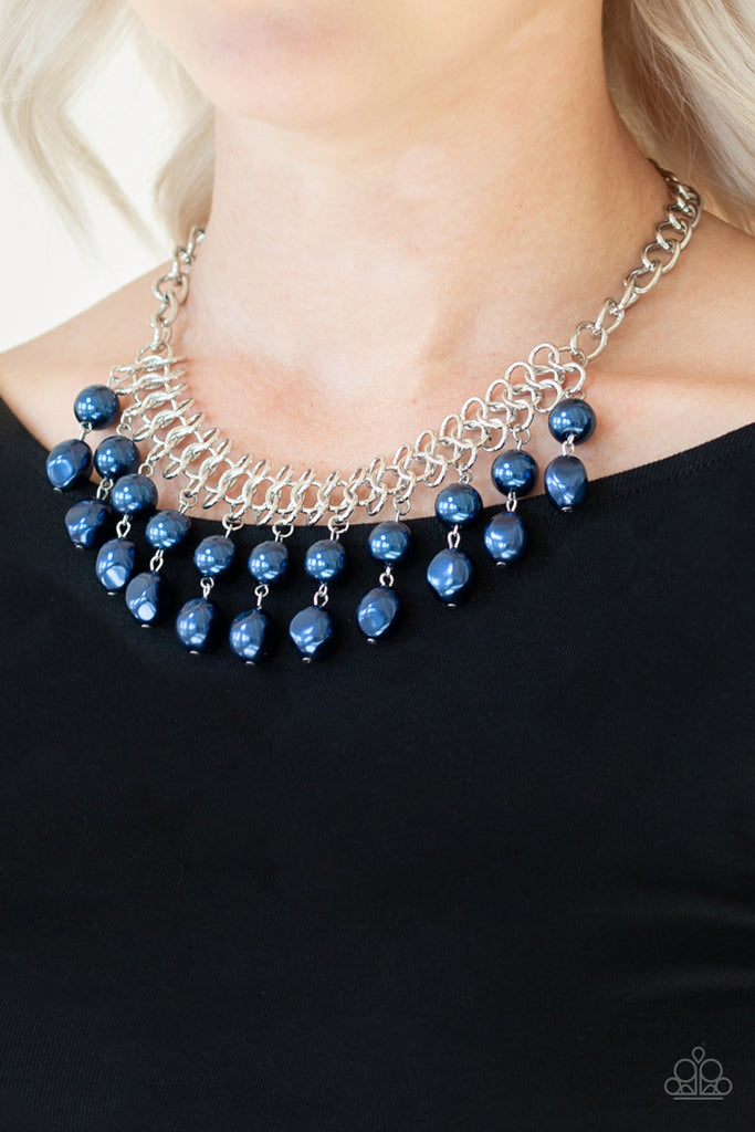  A collection of classic and imperfect blue pearls dangle from a web of interlocking silver links below the collar, adding a modern twist to the timeless palette. Features an adjustable clasp closure.  Sold as one individual necklace. Includes one pair of matching earrings.