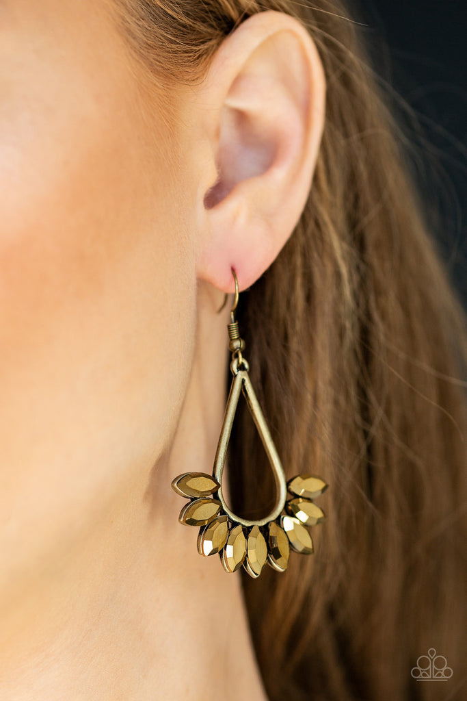 Marquise cut aurum rhinestones fan from the bottom of an antiqued bras teardrop, creating an edgy fringe. Earring attaches to a standard fishhook fitting.  Sold as one pair of earrings.