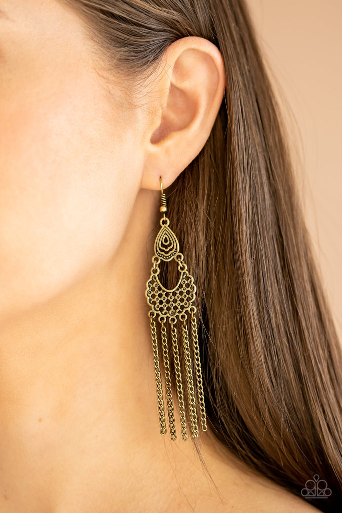 Pairs of shimmery brass chains cascade from the bottom of a stacked brass lure featuring airy filigree. Earring attaches to a standard fishhook fitting.  Sold as one pair of earrings.