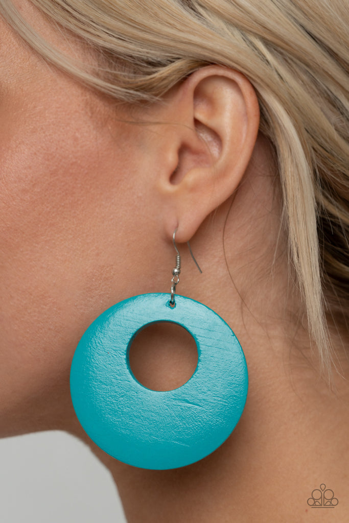 Painted in a refreshing blue hue, an oversized wooden hoop-like frame swings from the ear for a colorful look. Earring attaches to a standard fishhook fitting.  Sold as one pair of earrings.