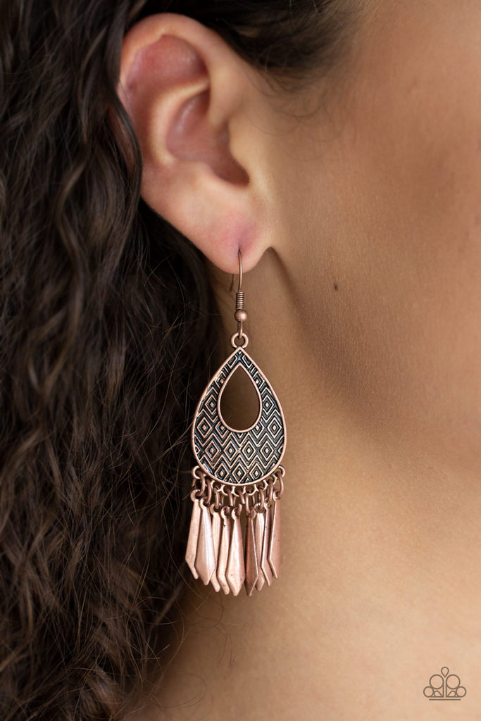 Embossed in a bold geometric pattern, a glistening copper teardrop frame gives way to a fringe of flared copper rods for a seasonal flair. Earring attaches to a standard fishhook fitting.  Sold as one pair of earrings.
