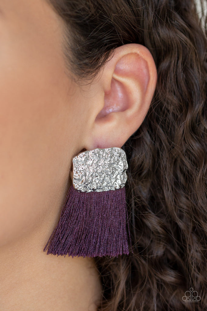 A plume of shiny purple thread streams from the bottom of a hammered silver frame, creating a bold tasseled look. Earring attaches to a standard post fitting.  Sold as one pair of post earrings.