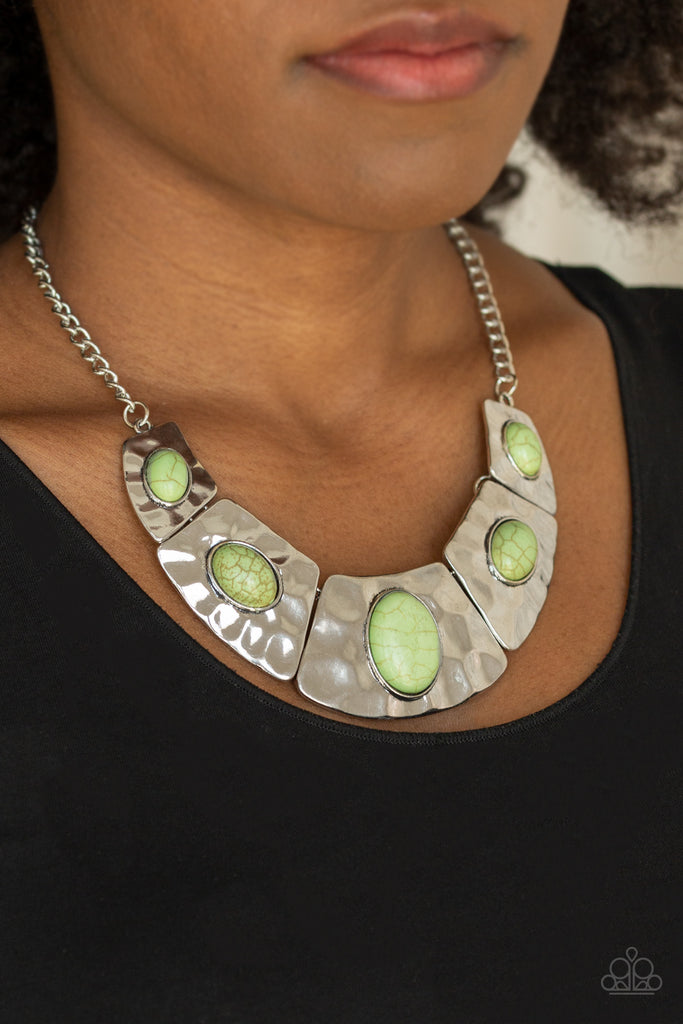 Dotted with earthy green stone accents, a collection of hammered silver plates link below the collar for an artisan-inspired look. Features an adjustable clasp closure.    Sold as one individual necklace. Includes one pair of matching earrings
