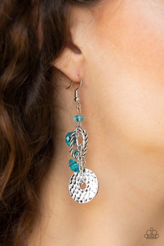 Glittery blue crystal-like beads trickle along a lure featuring a hammered silver disc and twisted silver fittings for an abstract look. Earring attaches to a standard fishhook fitting.  Sold as one pair of earrings.