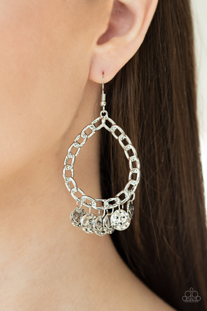 Hammered silver discs dangle from the bottom of a silver chain link teardrop, creating an edgy fringe. Earring attaches to a standard fishhook fitting.  Sold as one pair of earrings.