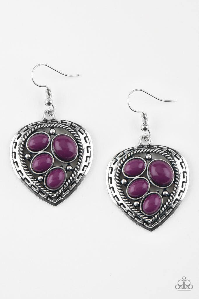 Varying in size, polished purple beads are sprinkled across the center of an asymmetrical heart-shaped frame for a whimsical look. Earring attaches to a standard fishhook fitting.  Sold as one pair of earrings.