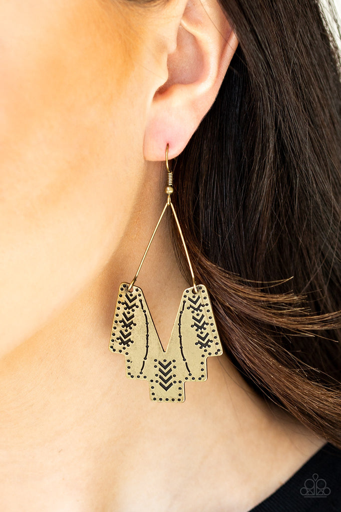 Stamped in tribal inspired patterns, an abstract geometric frame swings from a brass wire fitting for a tribal inspired look. Earrings attaches a standard fishhook fittings.  Sold as one pair of earrings.